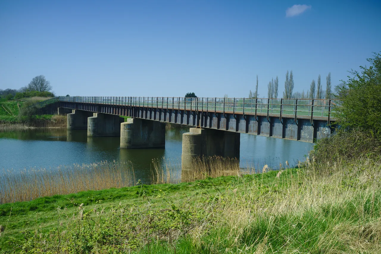 The Magdalen railway bridge, intact and spanning the Great Ouse relief channel.