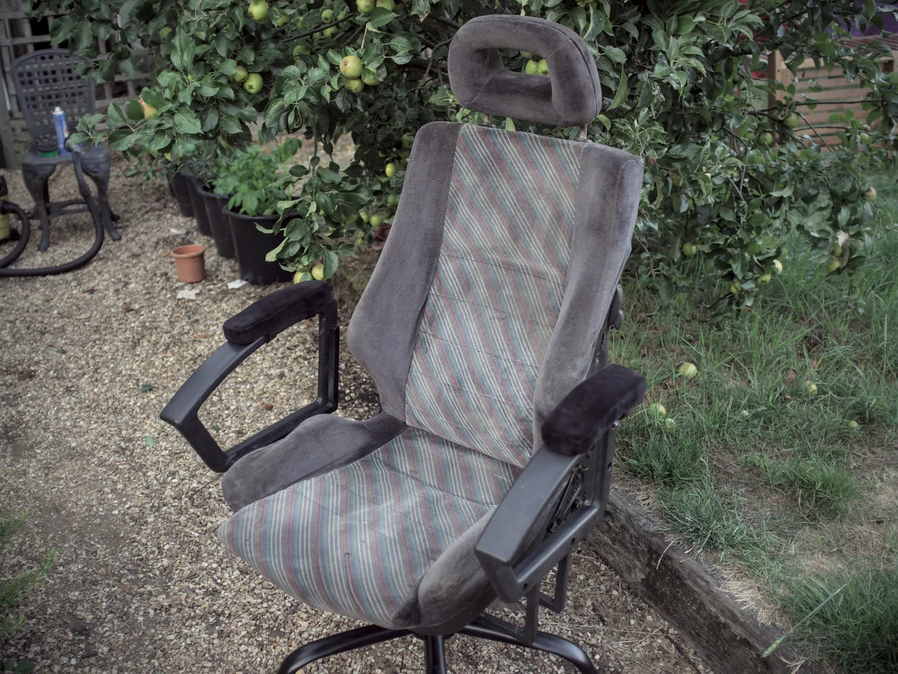 The desk chair, fully reassembled: an Astra GTE seat on a swivel chair base with armrests