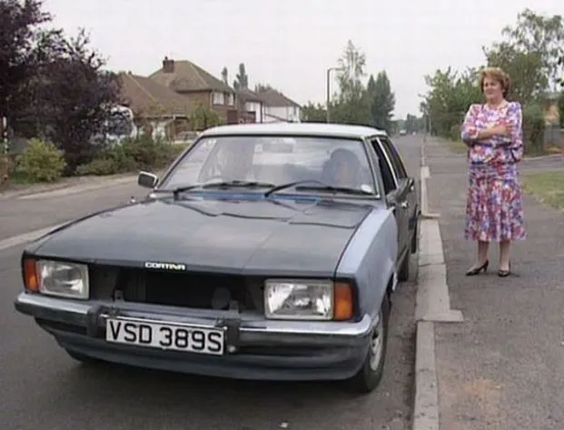 Onslow's Cortina in Keeping Up Appearances. It is mostly black, with one body panel missing and one clearly mismatched.