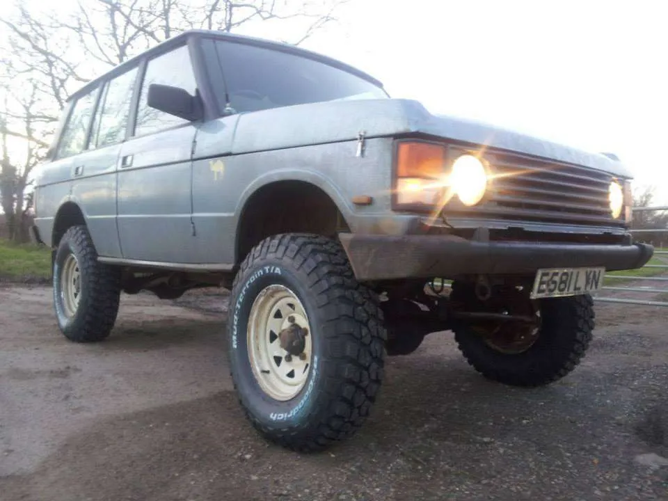 The photo is actually an extremely lifted 1987 Range Rover.
