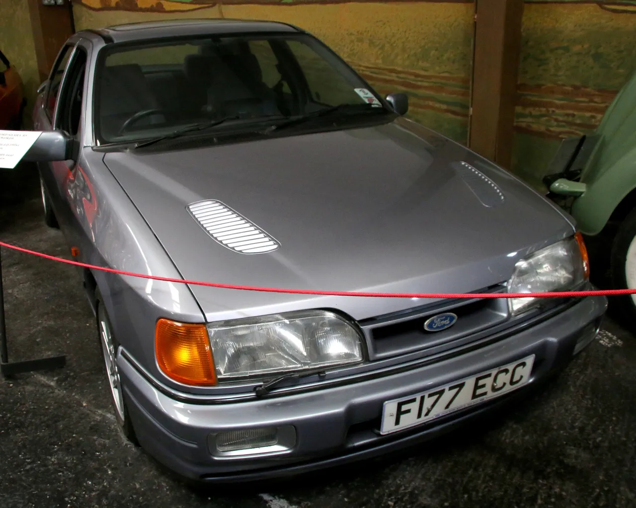 A Ford Sierra RS Cosworth, Sapphire generation. The bonnet vent overlaps a very prominent styling line on the bonnet.