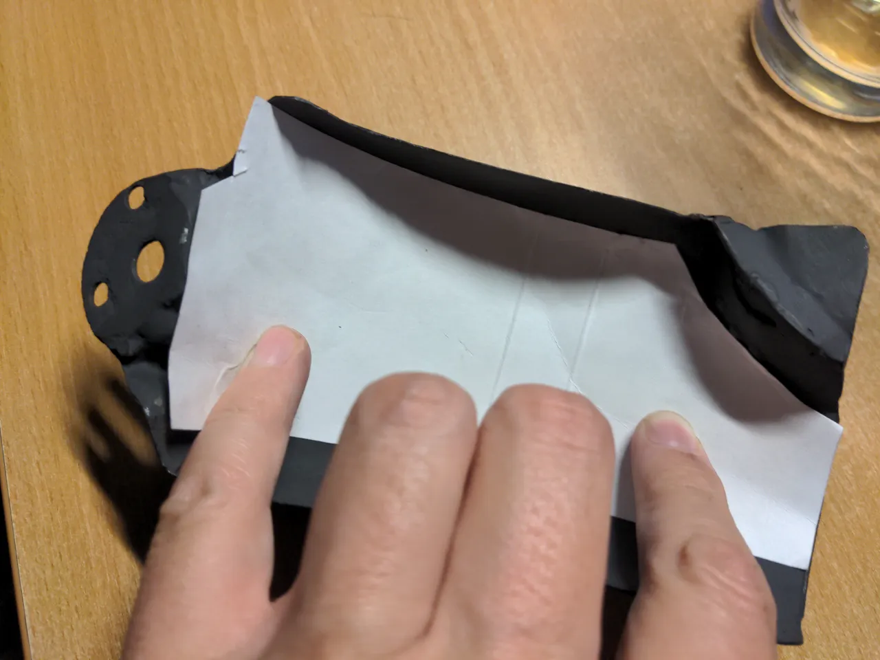 A cardboard template cut and sitting neatly inside my heat shield.