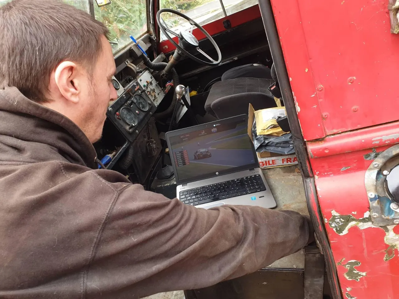 Me, watching a British Drift Championship livestream while working on the Land Rover.