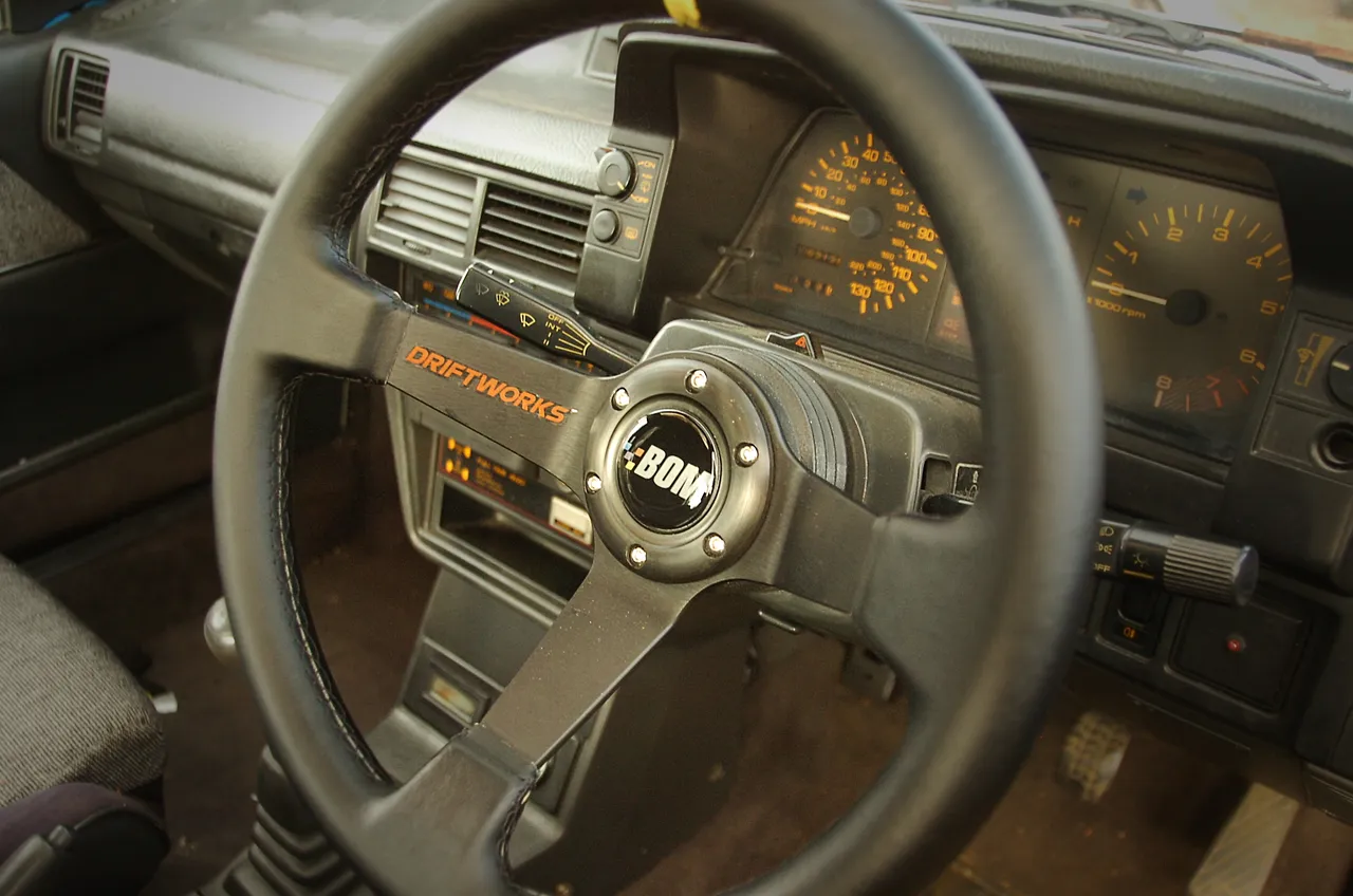 Bad Obsession Motorsport horn push sticker on Driftworks steering wheel