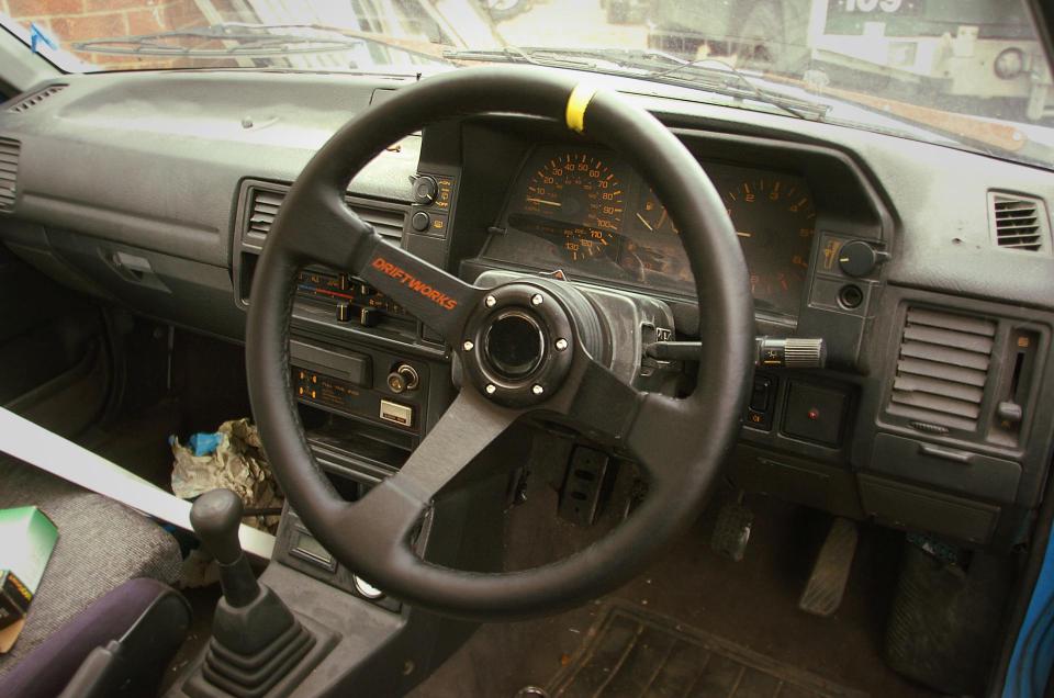 Driftworks leather steering wheel in Mazda 323 GTX interior