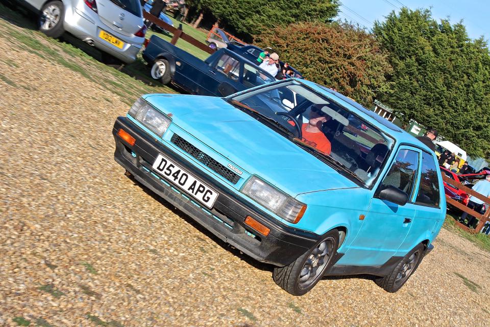 Me driving my 323 GTX out of a car park.