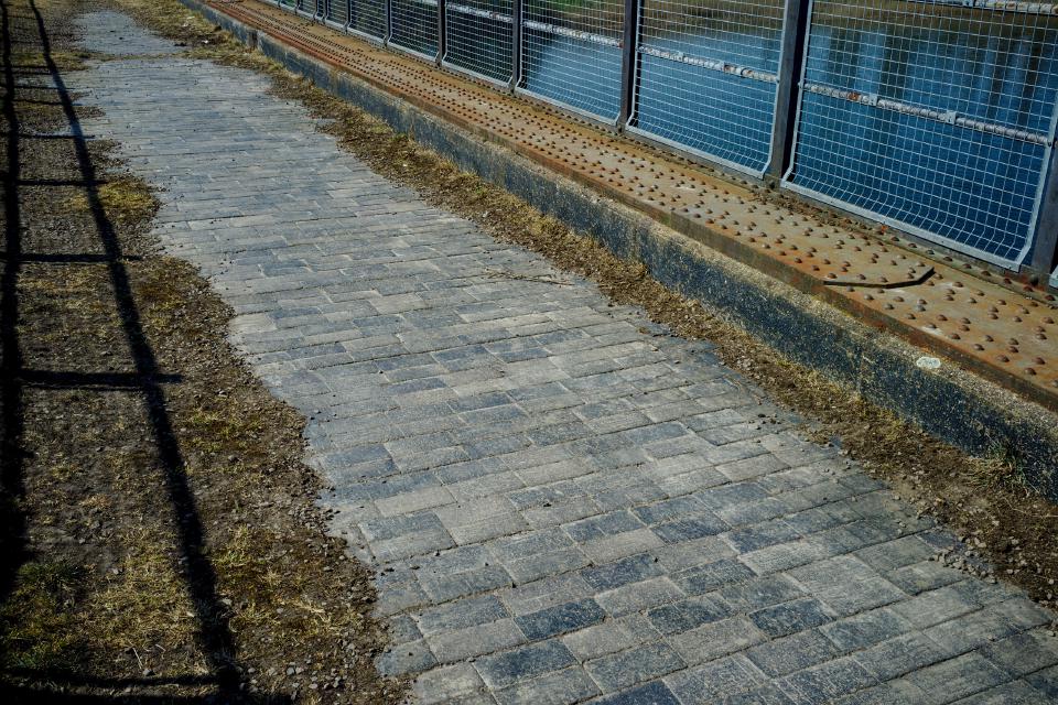 Bridge deck of the Magdalen railway bridge, showing brickwork where the ballast has been eroded.