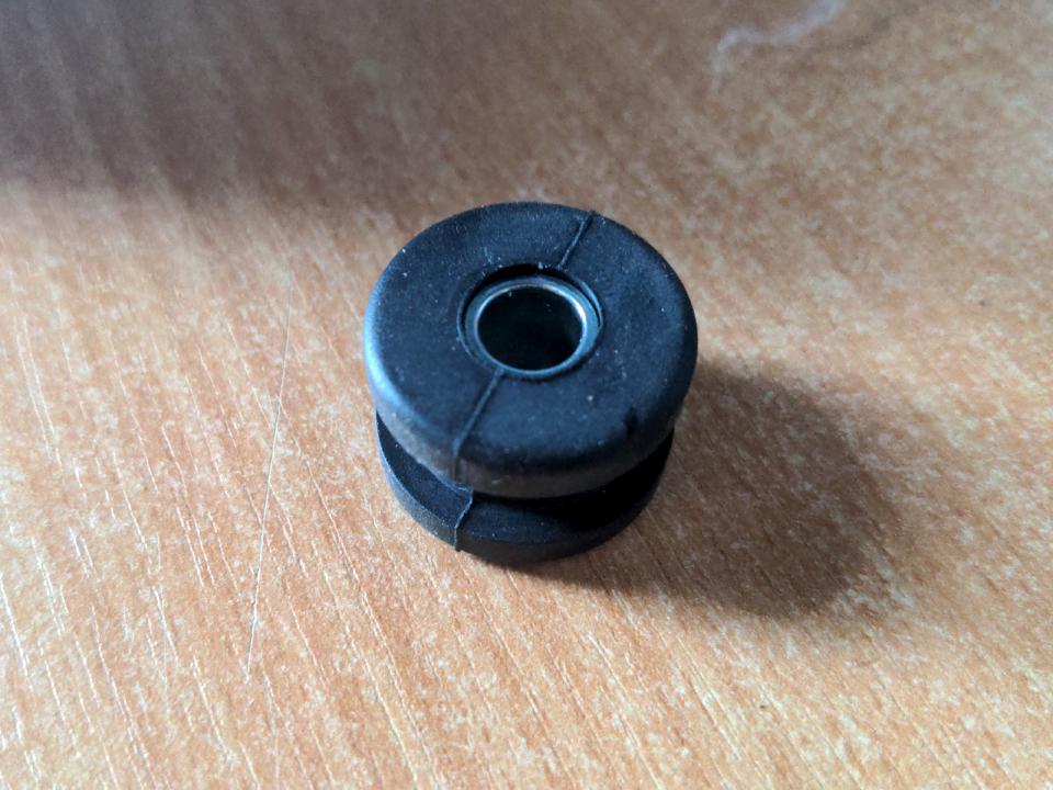 A brand-new black mounting rubber from a Yamaha TY 250