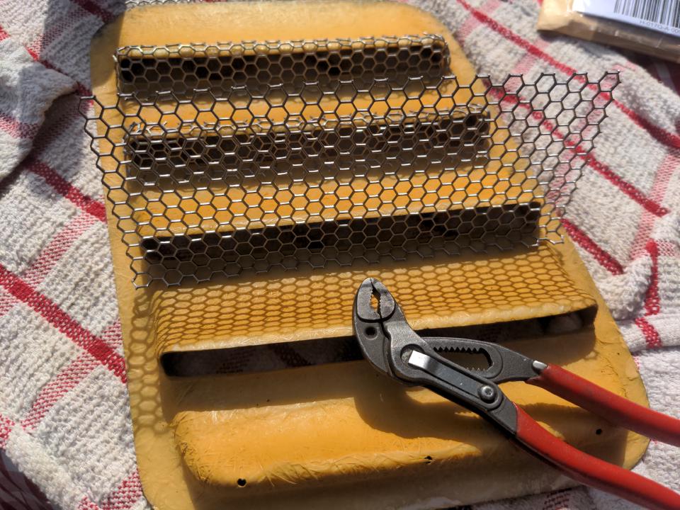 Some of the steel mesh cut and formed into pieces for each of the holes which will be fixed into place later.