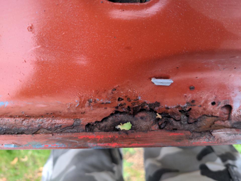 Daylight is visible through my bonnet. There is a hole, and plenty of rust.