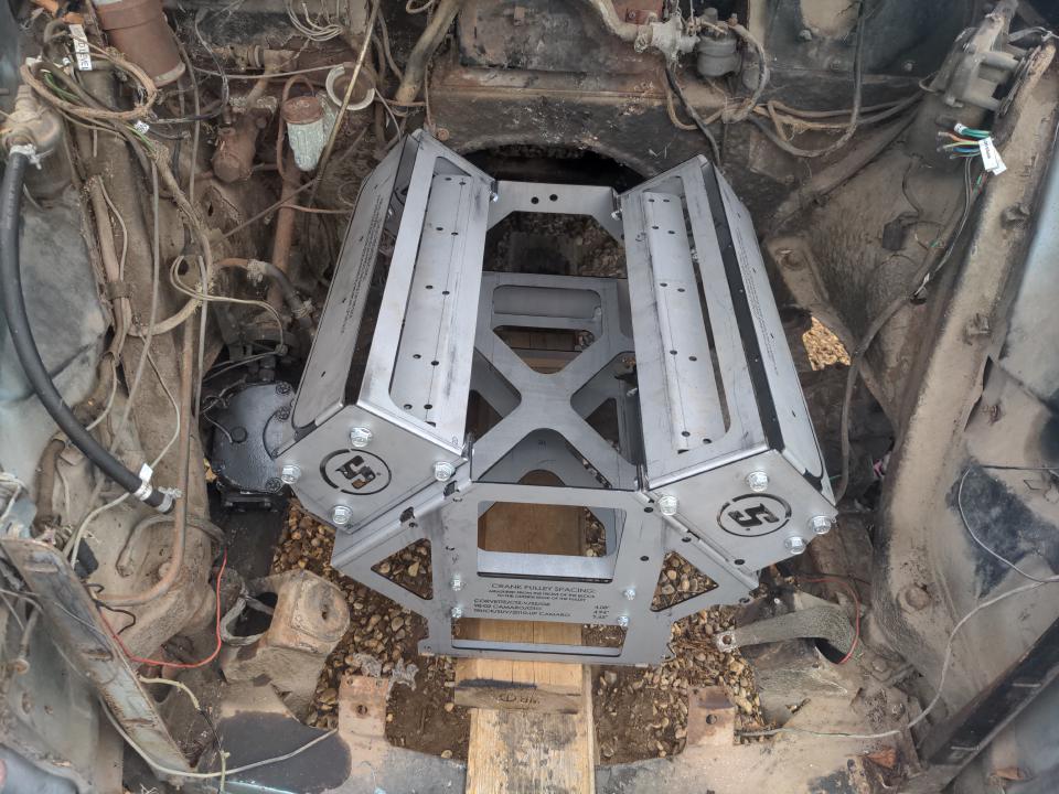 My stunt engine sitting in the engine bay of my Rover P5, held in more or less the right place with pieces of wood. There is lots of free space all around.