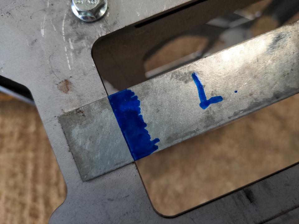 A demonstration of my alignment marks on the stunt pulley. A sharp blue line aligns with the edges of a rectangular cut-out