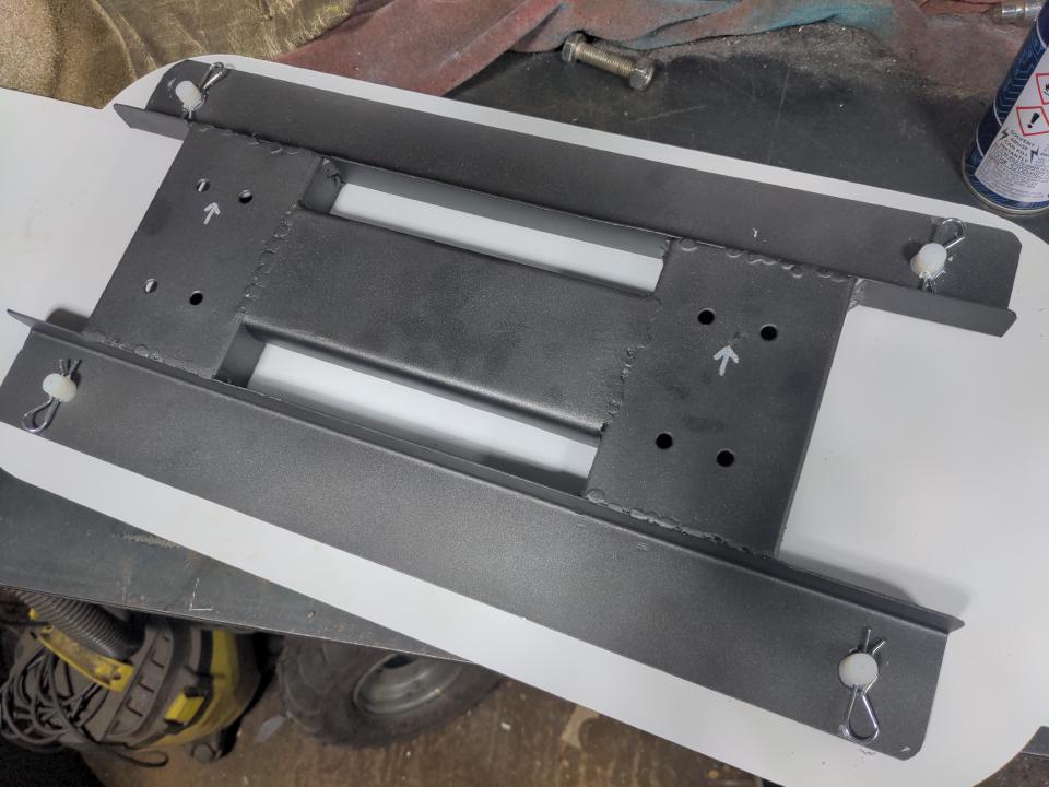 The bracket above, but it has been cleaned up a little and is painted in gunmetal grey Jenolite paint. Some R clips hold the bracket onto the back of the sign. When in place, the bracket will be completely hidden by the sign.