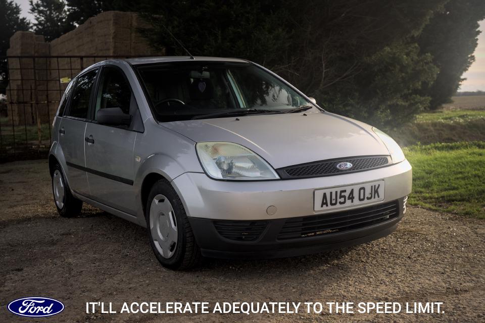 In the style of an advert, a photo of the Fiesta, with the text: It'll accelerate adequately to the speed limit.