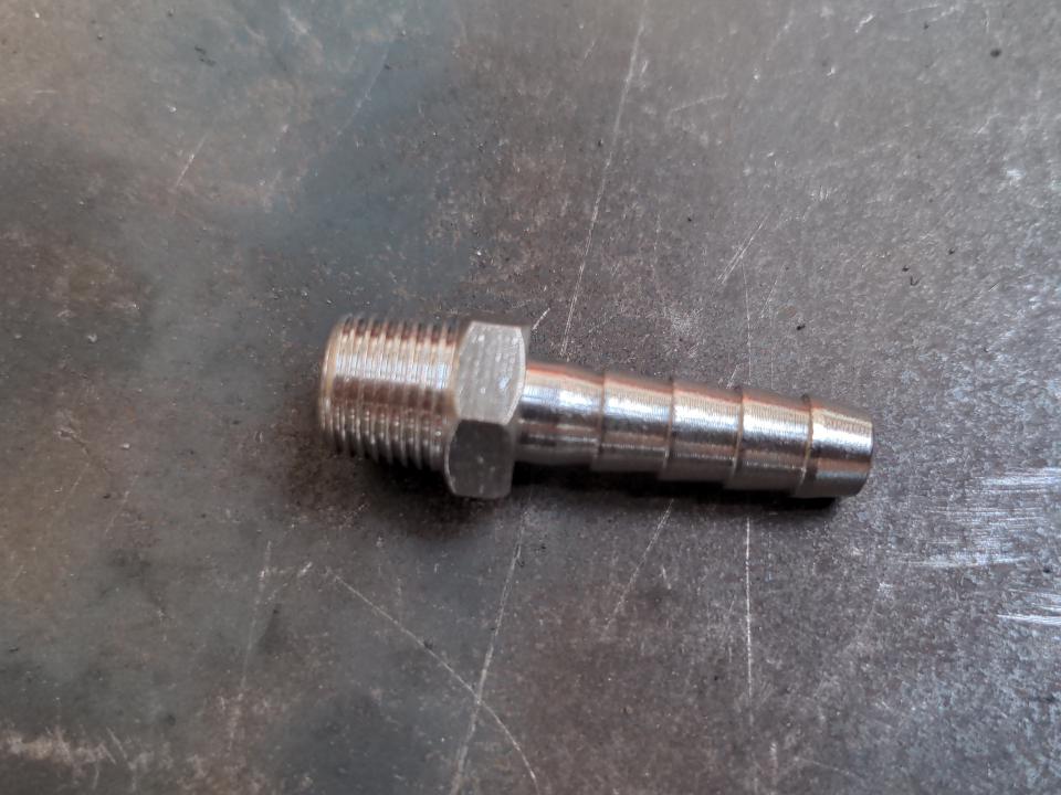 A 1/4 BSP to 6mm hose tail. On one end is a 1/4 BSP male thread; on the other is a barbed connector for an air hose to be pushed onto and clamped.