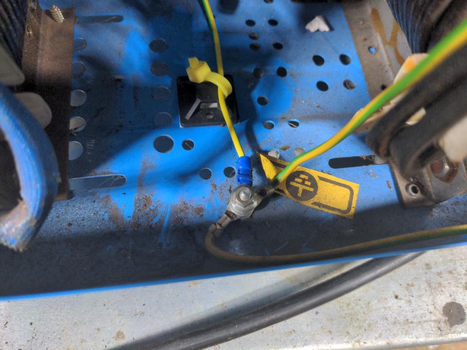 The earthing point on the bottom of the inside of my welding machine. It is a captive bolt that points upwards and ring terminals are held onto it with a nut.
