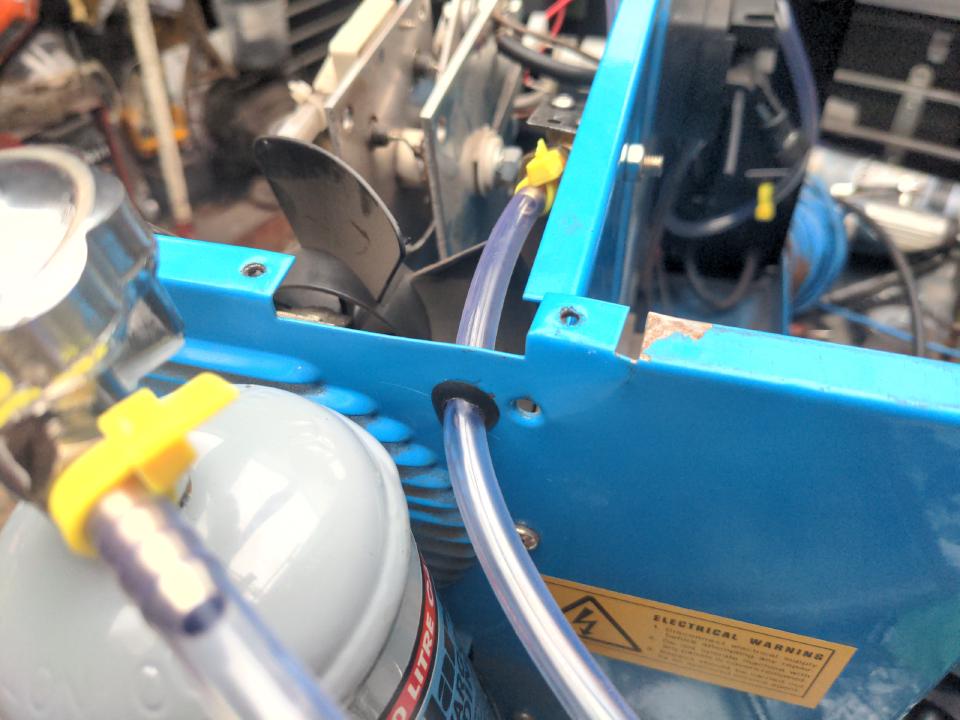 The hole in the back of my welder where the gas hose enters the body.