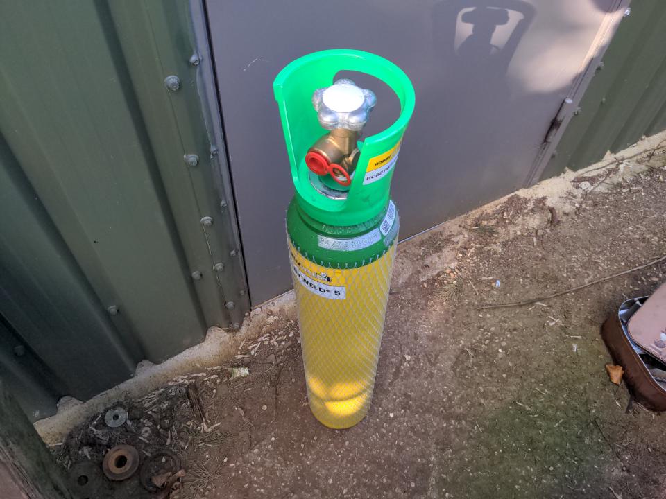 A re-usable CO2/argon shield gas bottle. It is about 90 centimeters tall and 20 centimeters in diameter. This will replace the disposable bottles.