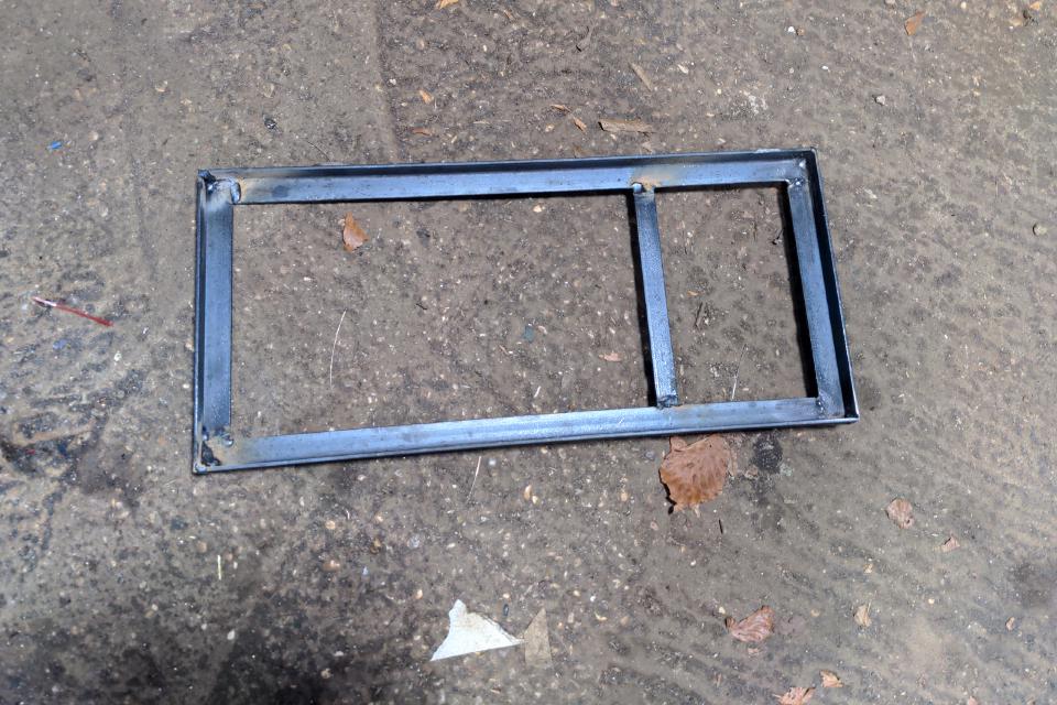 The initial version of my chassis. It is made of a rectangle of four pieces of angle iron, with one reinforcing crossmember positioned slightly further to one end.
