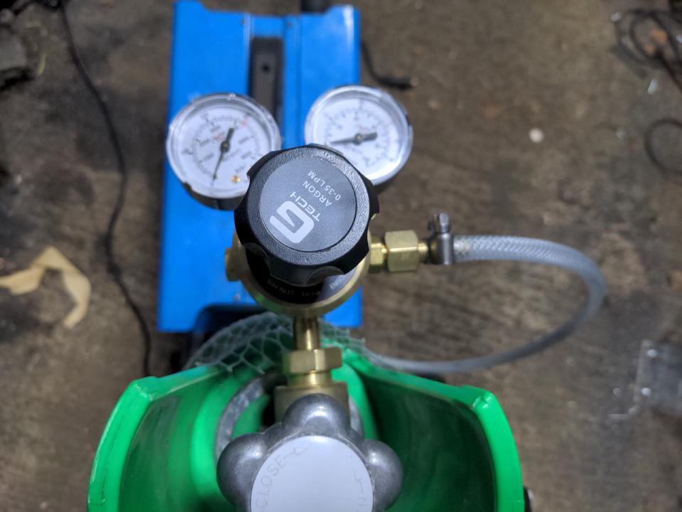 A regulator screwed in to my Argon/CO2 shield gas bottle. It has two dials; one reads gas pressure, and one reads gas flow.