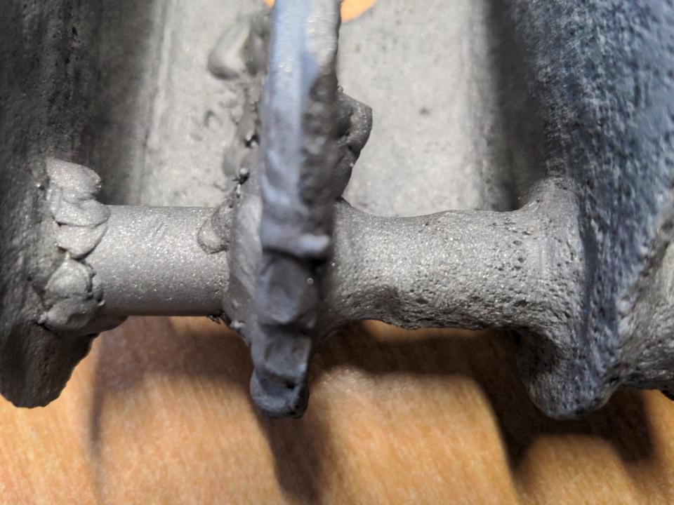 Another detail photo of my leaf spring perches. At the ends, a rod is slid through and then welded into place. This rod should be about 19mm thick. In places, it is visibly waisting down and is about 15mm thick in places. It has also had some fairly crude welding repairs made.