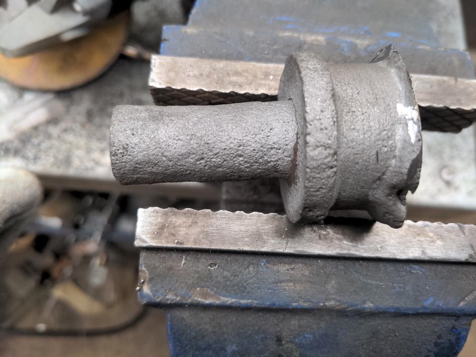 The shock absorber mount on my Rover P5. It is a large top-hat-shaped section with a hole through its center, through which a rod about 19mm wide sticks; the shock absorber attaches to the outside of this rod and it is bolted through inside. The 'donut' part is just a spacer to keep the shock absorber clear of the leaf spring mount.