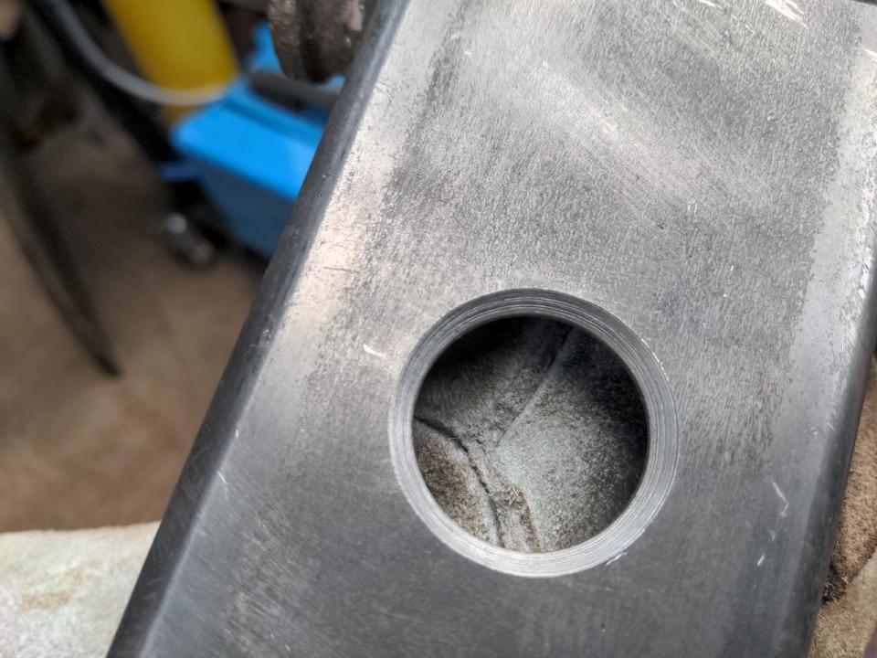 A 19mm hole in some steel, countersunk (so that it has a 45 degree ramp down to the 19mm bit).