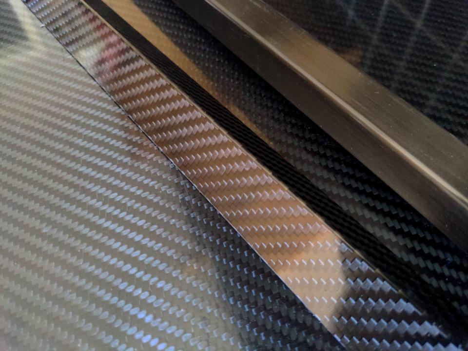 Some carbon fibre sheet, angle, and box section.