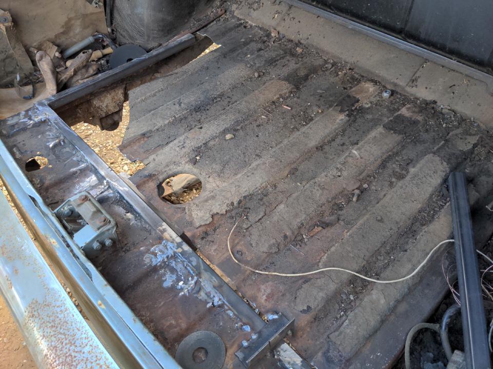 A view inside the boot of my Rover P5. I have cut out half of a large rectangle (two adjacent sides) from the floor, and where the edges were have been replaced by 1 inch square steel box section.