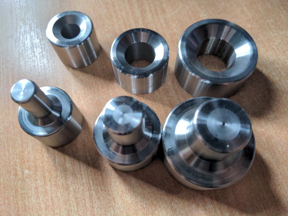 A set of dimple dies in half inch, three quarter in, and one inch sizes.