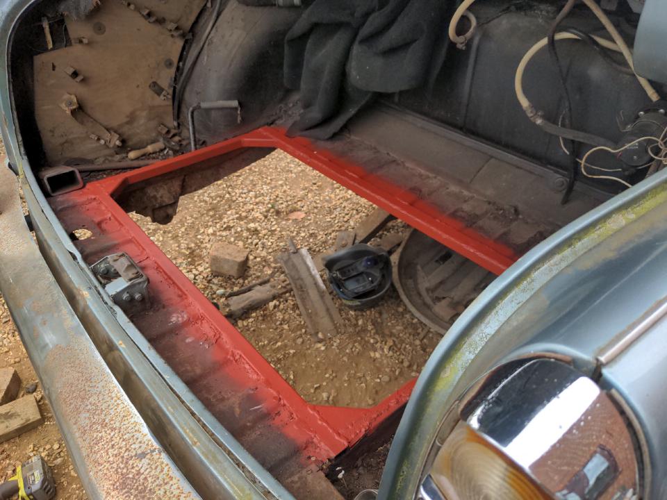 My boot floor in my Rover P5. A massive rectangular hole measuring about 1 metre by 60cm (off the top of my head) has been cut out of it. Around the edges of the hole I have welded in 1 inch box section steel, gussetted at the corners with triangle slices of 2 inch by 1 inch box section. Anti-rust red primer has been sprayed on the new steel and the areas which have been welded.