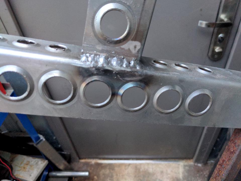 Twelve dimple die holes made in a piece of steel.