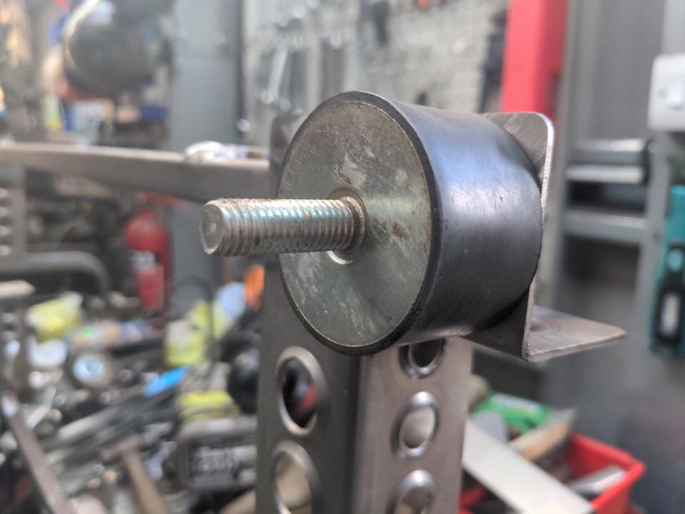 An M10 anti-vibration rubber bolted into my radiator mounting frame. It is a cylinder made of rubber, with an M10 bolt sticking out each end. This isolated whatever is bolted to the rubber from vibration (and some amount of movement) from the other end.