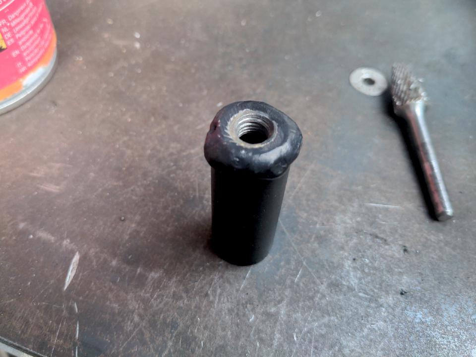 A piece of 19mm steel tube, a couple of inches long, with an M8 nut welded on to the end of it.