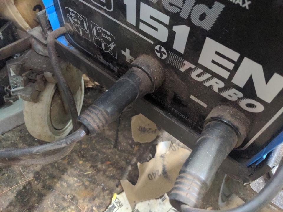 The front of my other MIG welder shows that the earth clamp and torch feed in/out through two Dinse-type sockets; that allows them to be switched over.