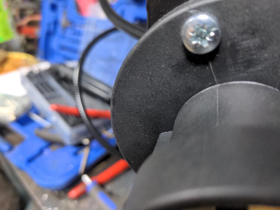 The left edge of a Euro torch front connector. This is circular and about 80mm in diameter. The edge is extending past the left edge of the front panel, which means it needs trimming.