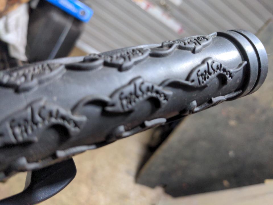 Some Fred Salmon handlebar grips. They are wider than the previous grips, and their grip pattern is shaped like fish.