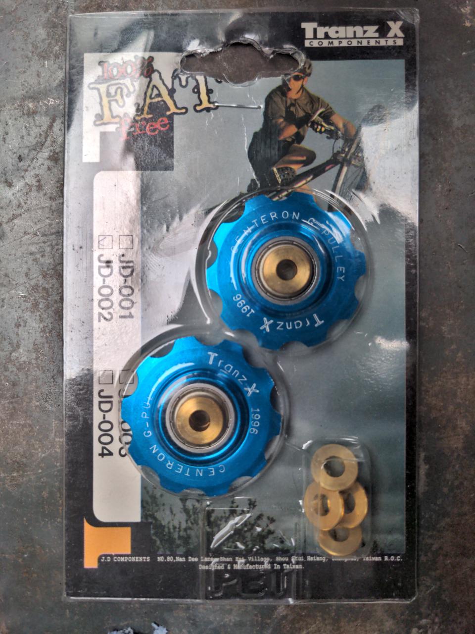 Blue anodised Trans-X jockey wheels in their original packaging