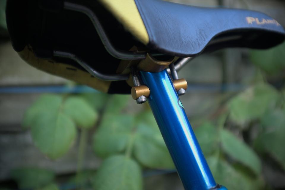 A close-up of a USE seat post clamp; it has a bolt at the front and one at the rear