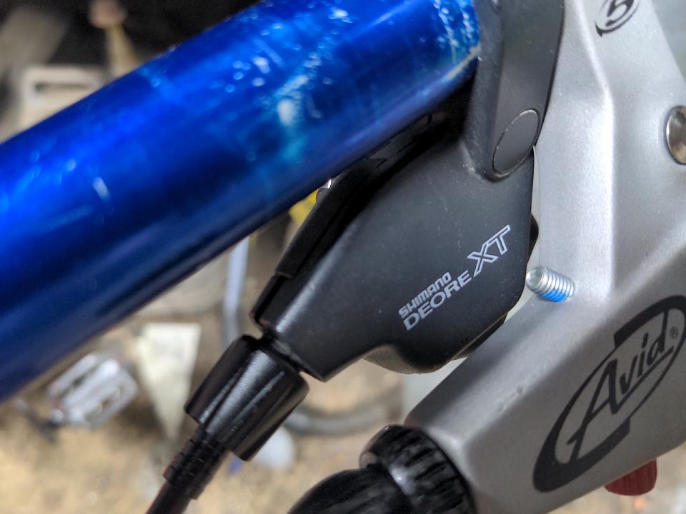 The new shifters; they are plain black other than having "Shimano Deore XT" written on them, and they lack gear indicator windows.