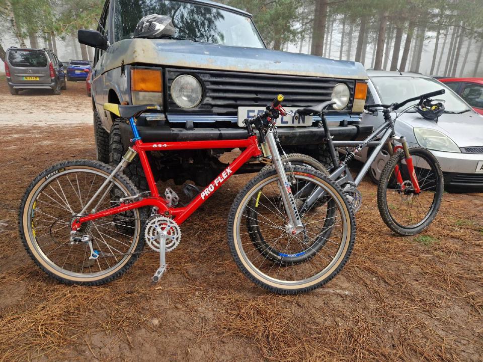My Proflex and a more-modern Marin leaning against a 1980s Range Rover.