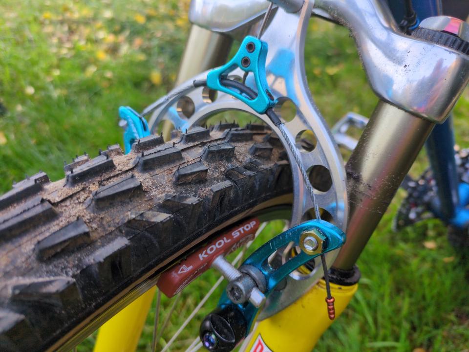 The "Death triangle" as I call them is a triangle in which the cable comes from the brake lever at one corner at the top, then a straddle cable between the two cantilever brakes comes out of the other two corners.