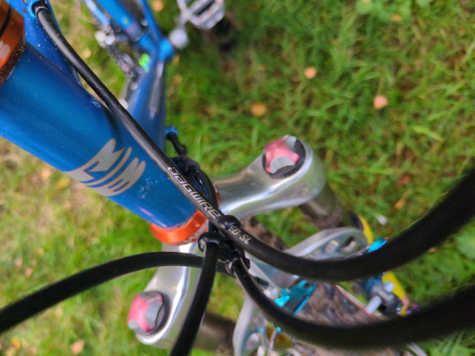 A view of my a bundle of outer cables; they are black and have JAGWIRE text.