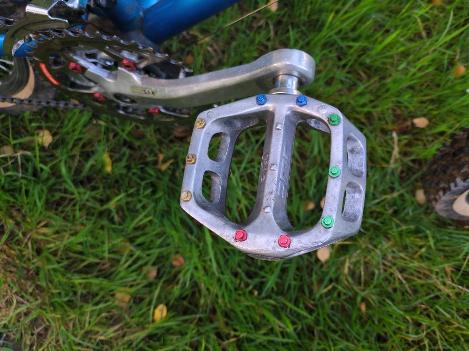 My silver DMR V12 pedals with multicoloured studs.