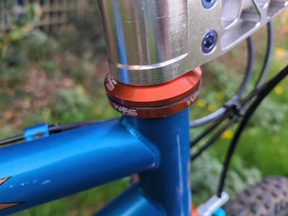 The cups of my headset, fitted. They are orange and have WFS written on them.