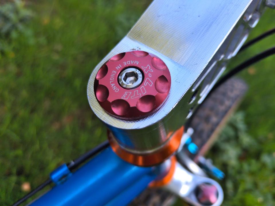 The top cap of my headset; it's an X-Lite one in a rose colour, with "MADE IN ENGLAND" writing and a nice design.