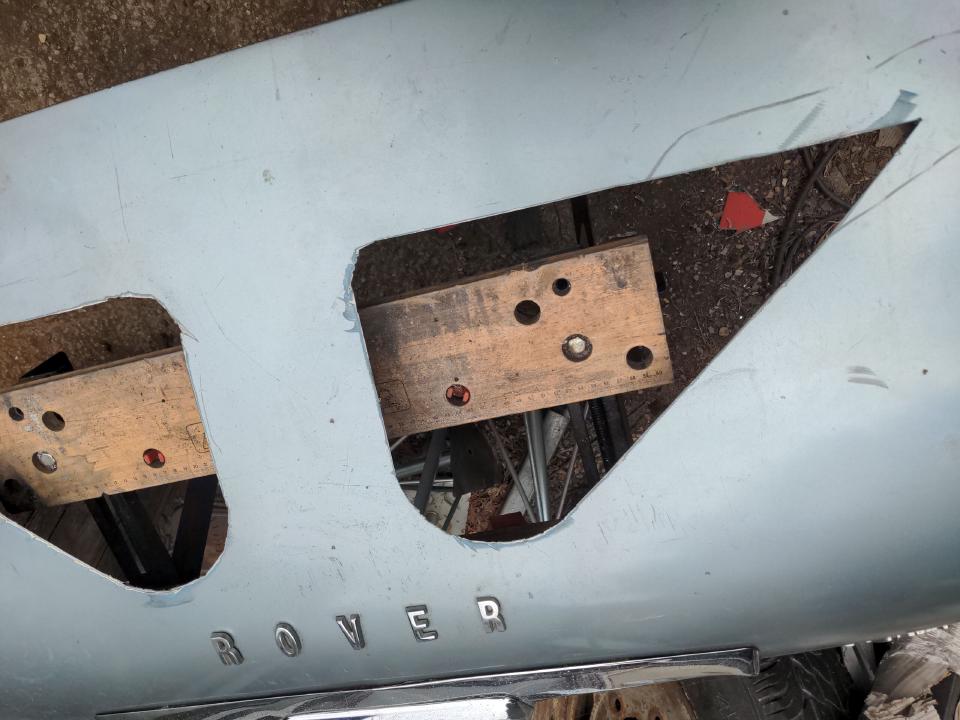 The boot lid of my P5 with two massive triangular holes cut into it.