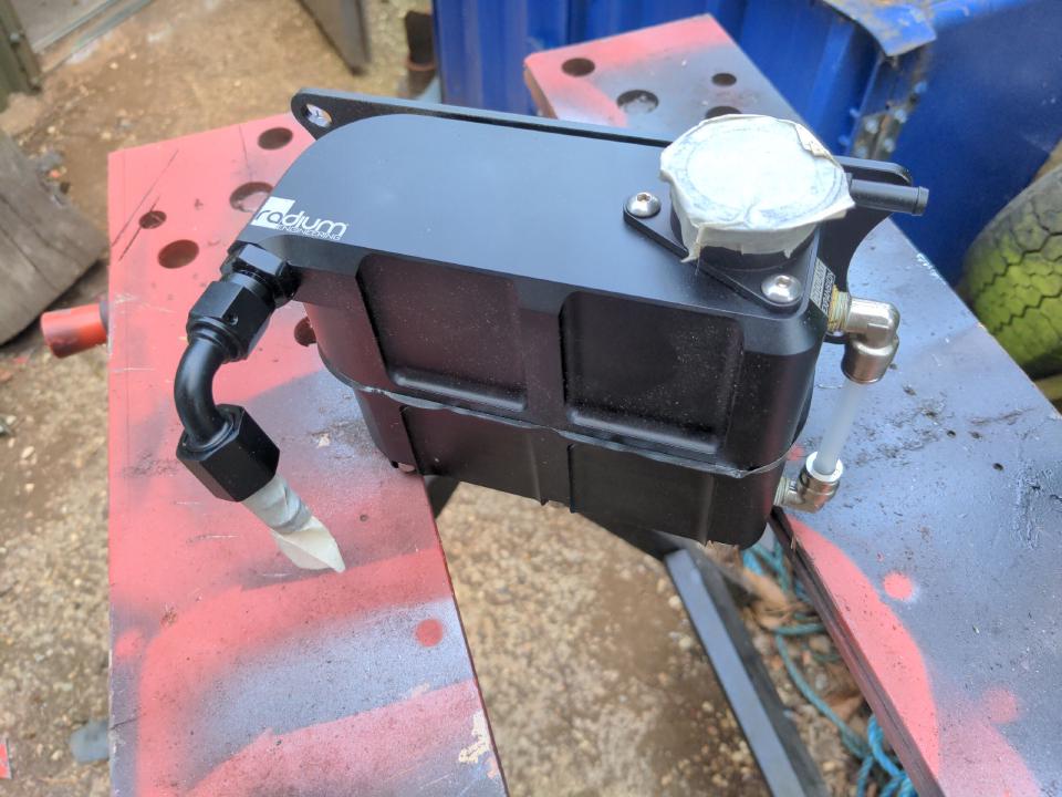 The expansion tank to be fitted to my P5, made by Radium. It is CNC machined; it is made of two halves that are bolted together.