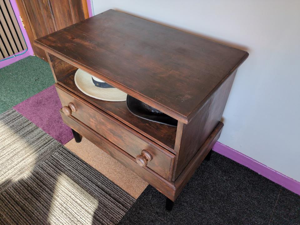 The same small set of drawers, but now with a dark wood stain.