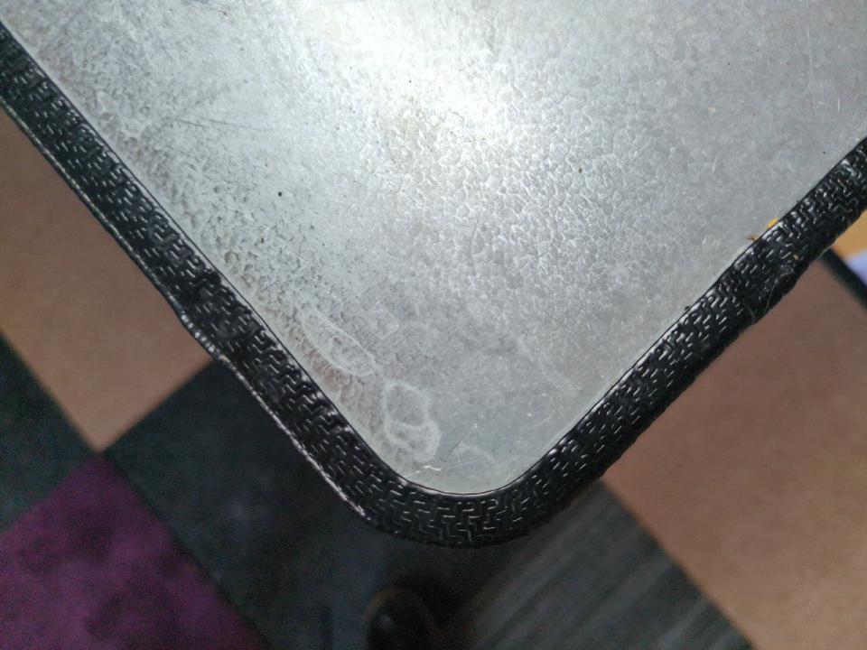 A demonstration of the corners of the worktop; they have been radiused and edge trim has been added to it.